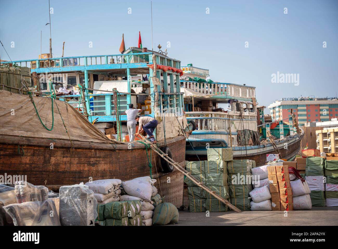 Wooden dhow cargo boats loaded with merchandise on Dubai Creek, United Arab Emirates Stock Photo