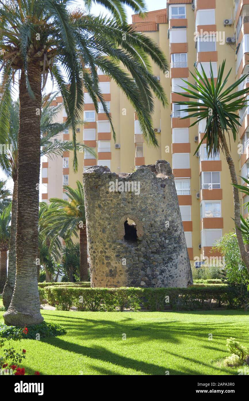 Old ladeada tilted sentinel tower in Algarrobo Costa , Malaga, Spain Stock Photo