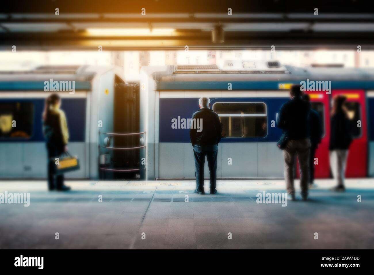 Blurry concept image of people travel by train on railway platform at  MTR train station in HongKong Stock Photo