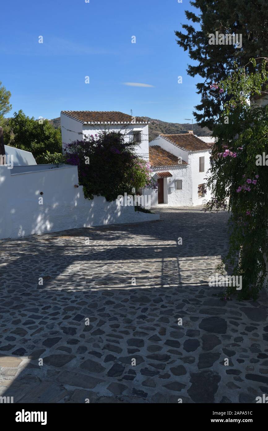Typical street with whitehoused in Macharaviaya, Andalusia, Spain Stock Photo