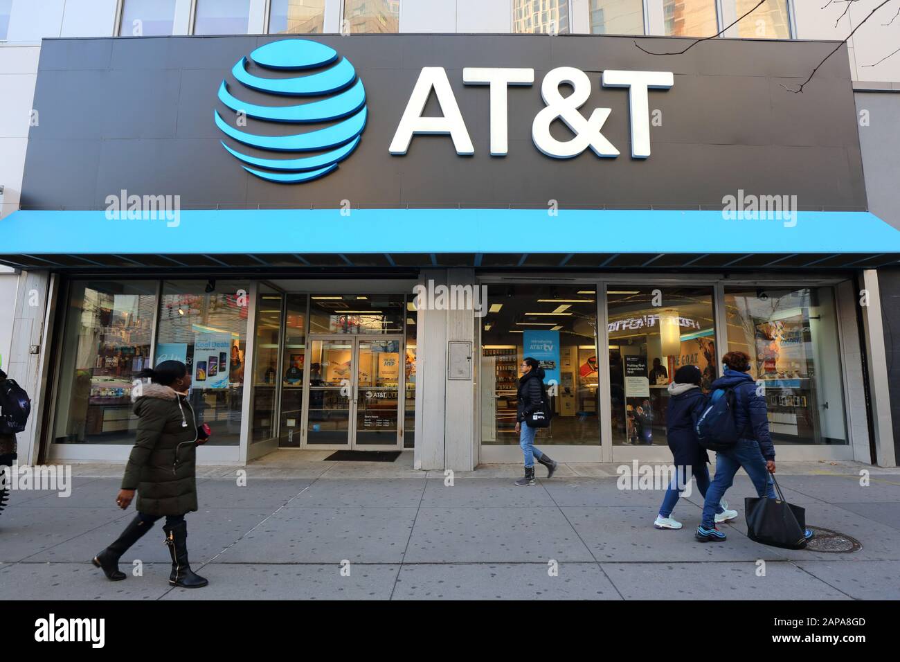 AT&T Store, 476-478 Fulton St, Brooklyn, NY. the gigantic logo of a telecommunications company and cellphone shop overlook shoppers on the Fulton Mall Stock Photo