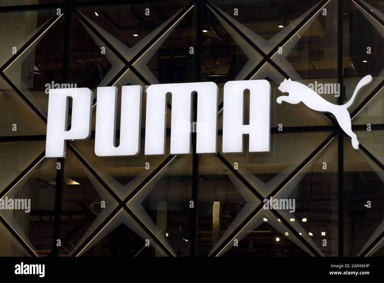 A gigantic Puma logo on a background of glass at their flagship store in Manhattan's Fifth Avenue, New York, NY Stock Photo