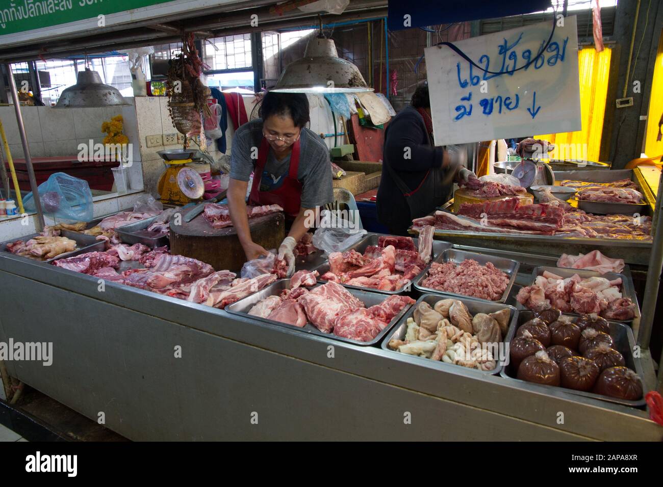 Meat stall in Chiang Mai Market woman seller Thailand Stock Photo