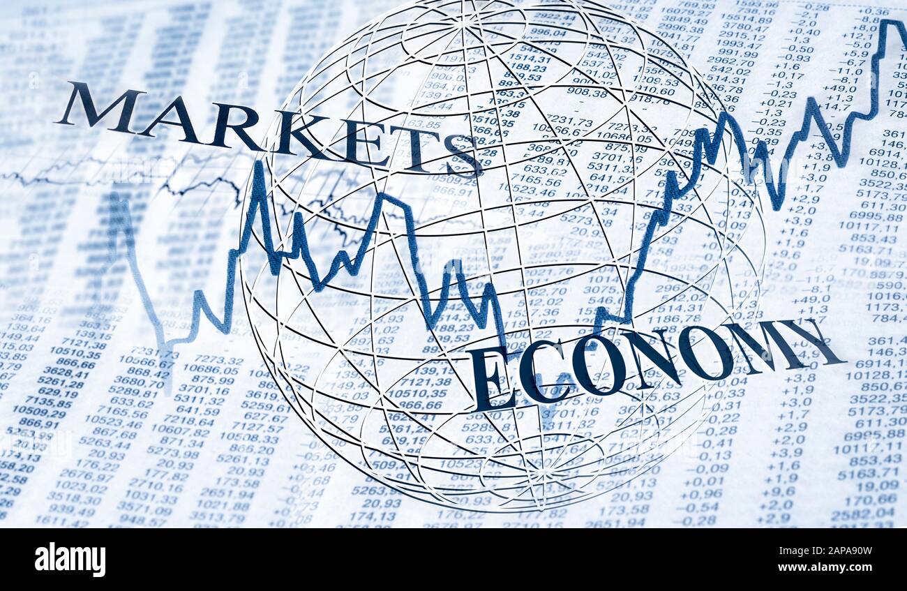Tables with stock prices and charts and the terms markets and economy Stock Photo