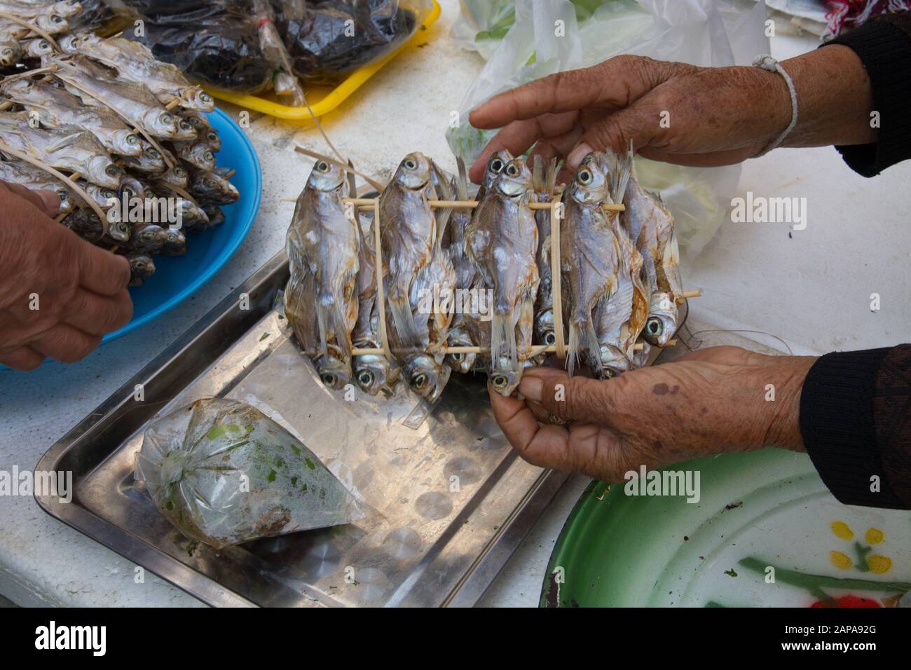 Thailand Chiang Mai Market fishes prepared to cook people shopping Stock Photo
