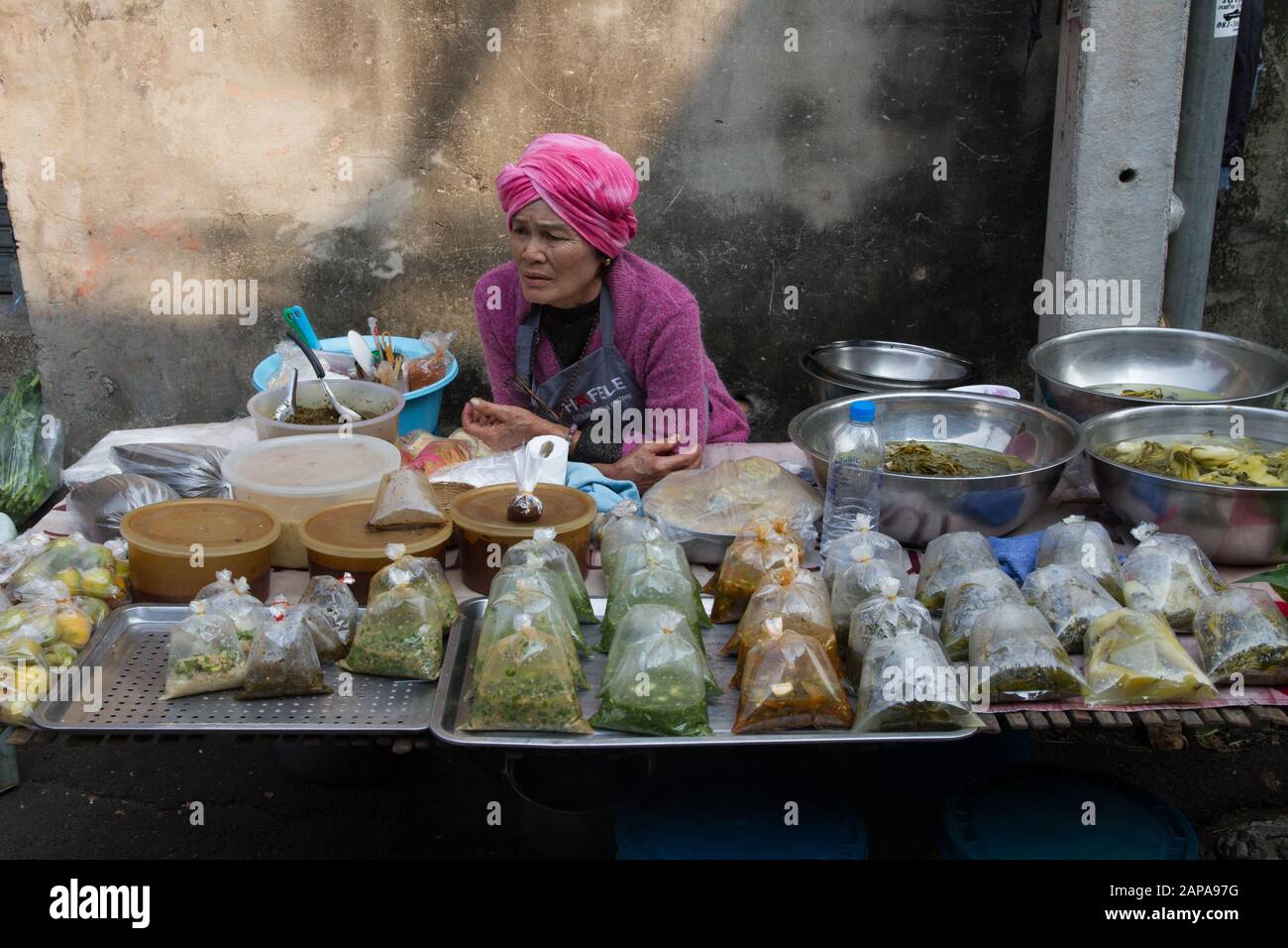 Chiang Mai woman seller in Market stall  Thailand Stock Photo