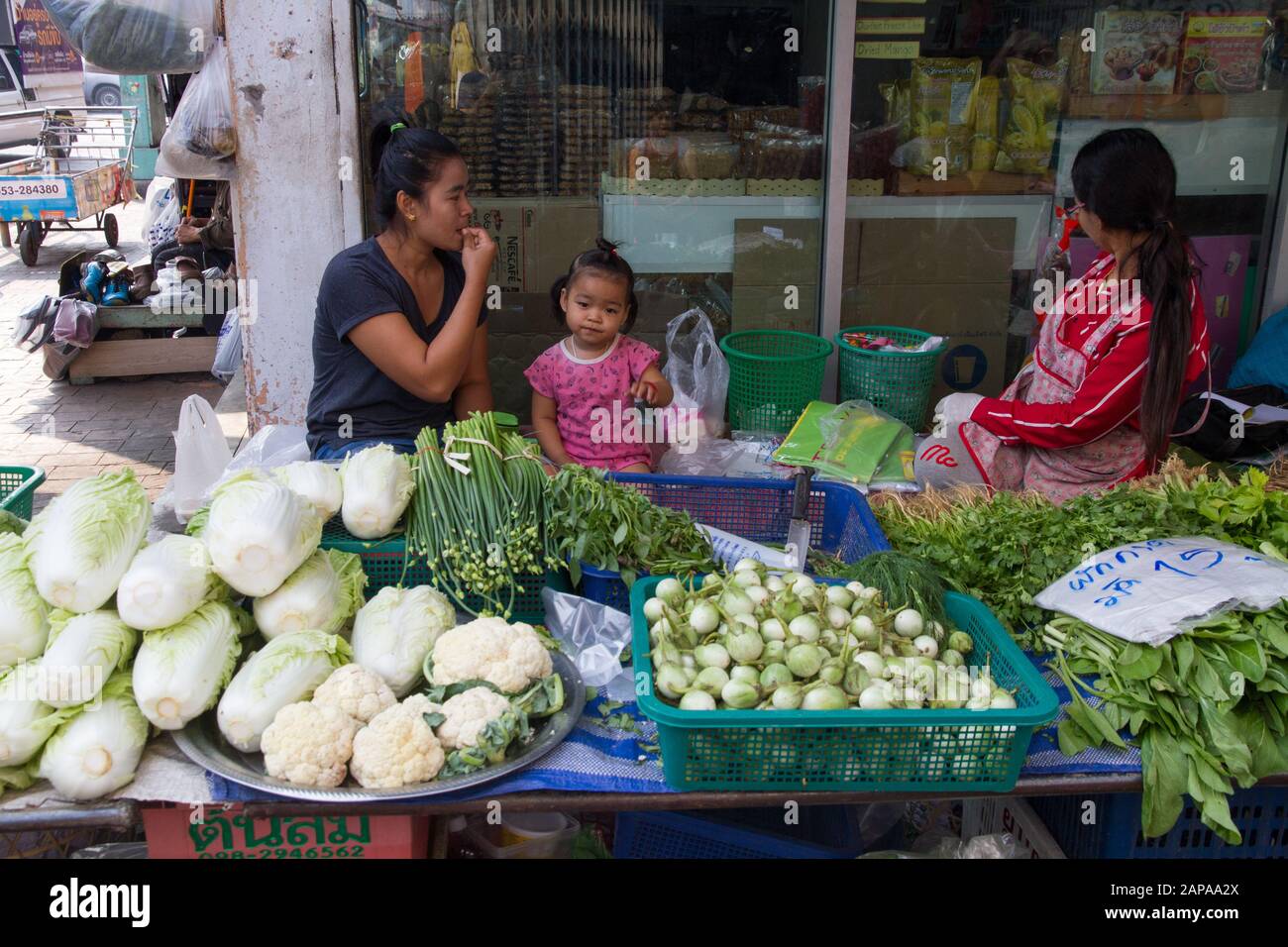 Chiang Mai Market fruits vegetables stall women seller Thailand Stock Photo