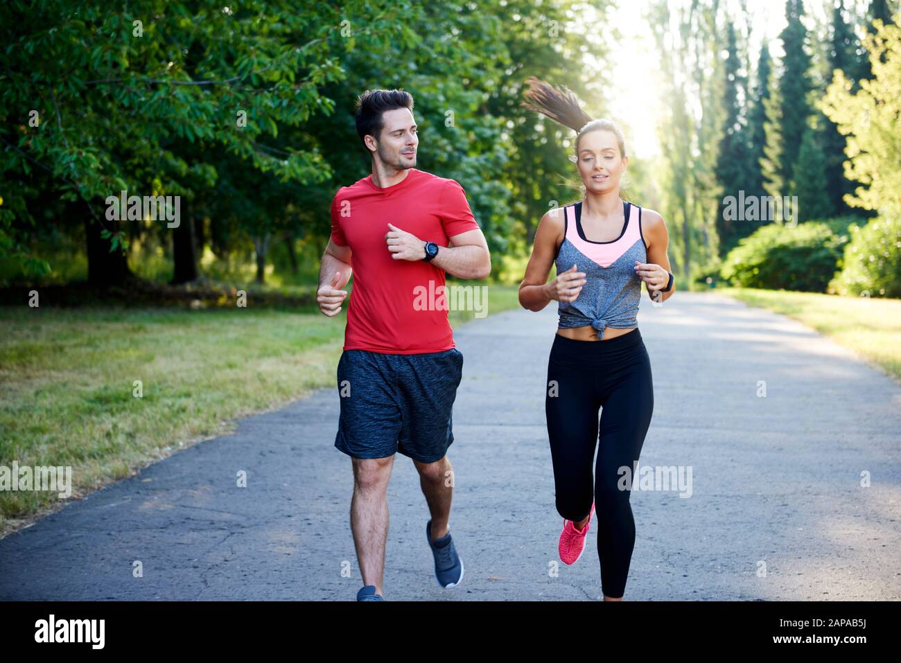 Running with partner make it is more pleasure Stock Photo