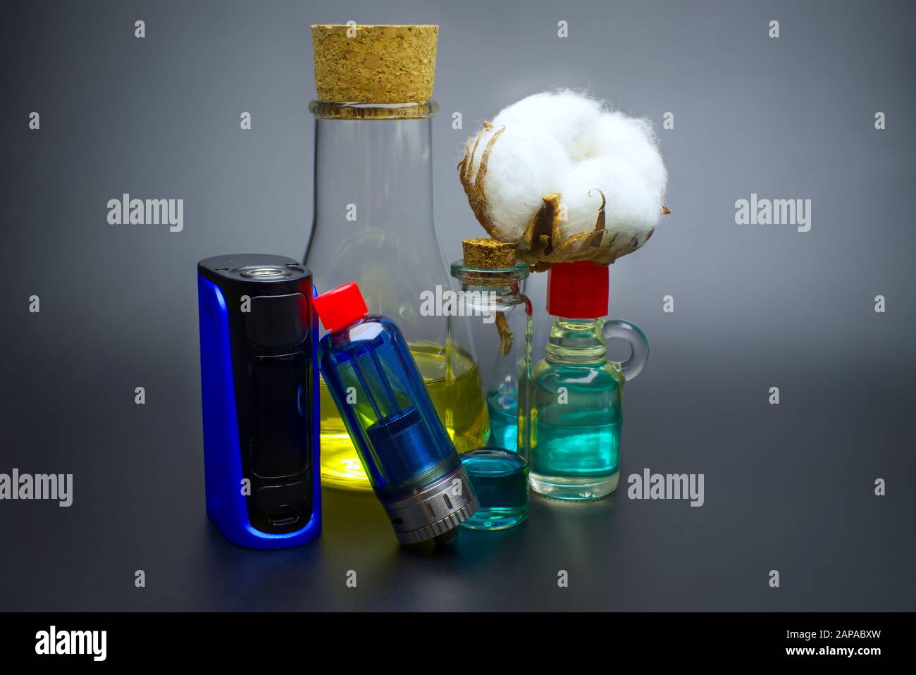 Electronic cigarette or vaping devices with natural cotton, cork stopped  flask with vape liquid Stock Photo - Alamy