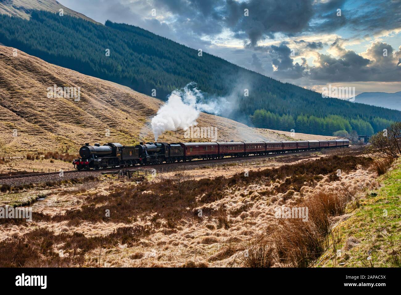Steam engines K4 61994 The Great Marquess and 8F 48151 Gauge O'Guild pull a special on the West Highland Line north of Tyndrum in Scotland Stock Photo