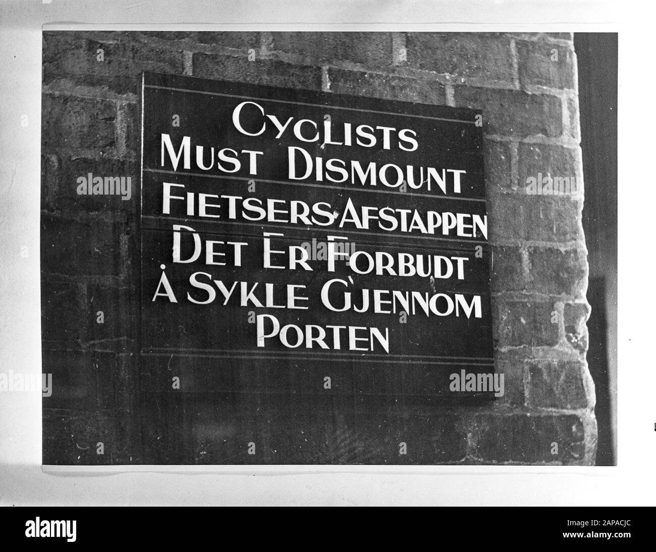 NAVY [Navy] Anefo London series Description: Sign in London in three languages Cyclist must dismount/ Cyclists get off/The Er Forbide a sykle gjennom porten Date: May 1944 Location: Great Britain, Scotland Keywords: signs, navy, world war II Stock Photo