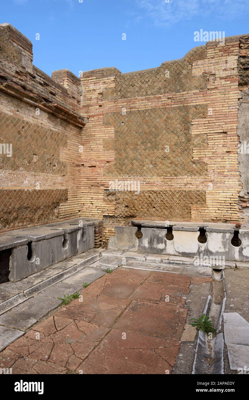 Rome. Italy. Ostia Antica. Public latrine (forica), possibly 4th century AD, Via della Forica, Caseggiato dei Triclini. Regio I Stock Photo