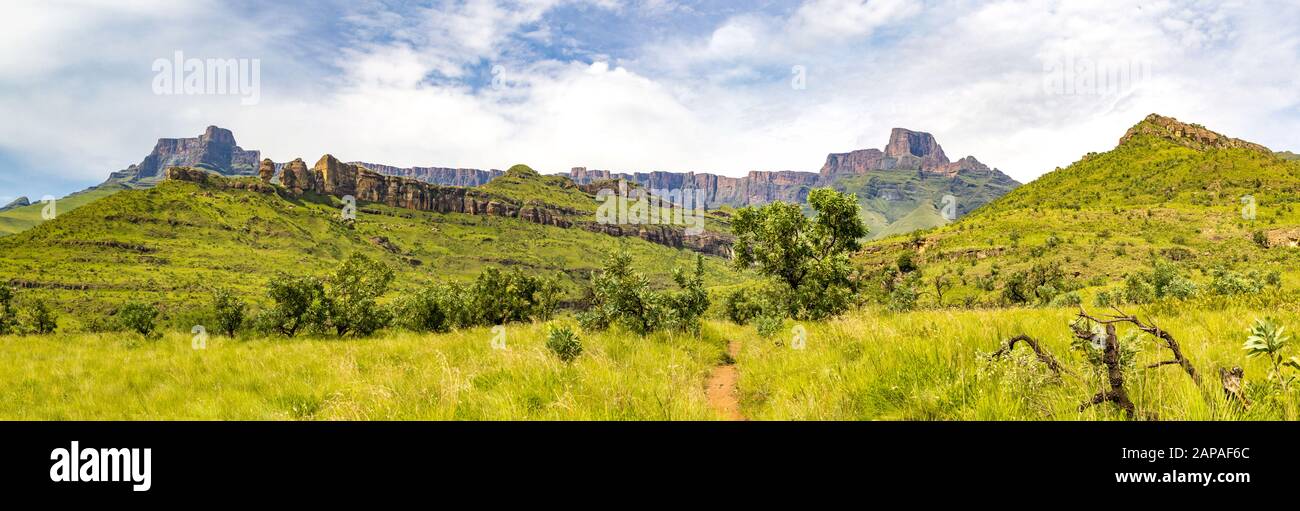 Panorama of the Amphitheatre and a hiking trail to Policeman's Helmet, Drakensberg mountains, Royal Natal National Park, South Africa Stock Photo