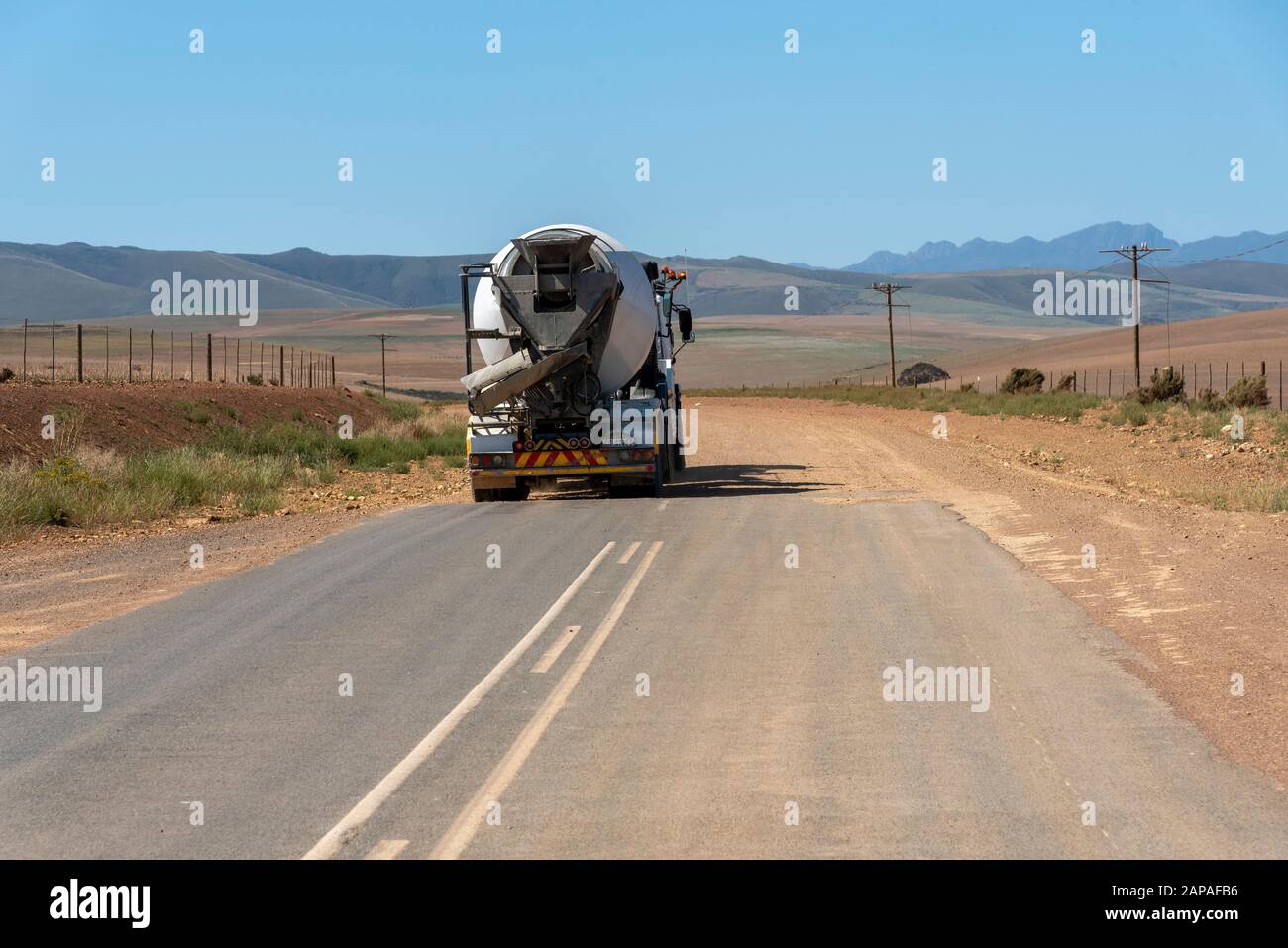 Caledon, Western Cape, South Africa. December 2019. Truck travelling from a tarmac to a dirt road in countryside close to Caledon, South Africa. Stock Photo