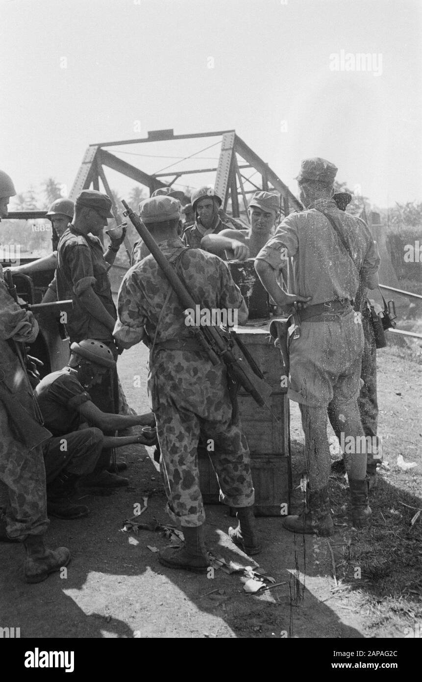 Tegal Description: The bridge at Tjomal is delayed. Then the cook opens his cold buffet, cake and zopie tea and biscuits. Date: July 1947 Location: Indonesia, Java, Dutch East Indies, Tegal Stock Photo