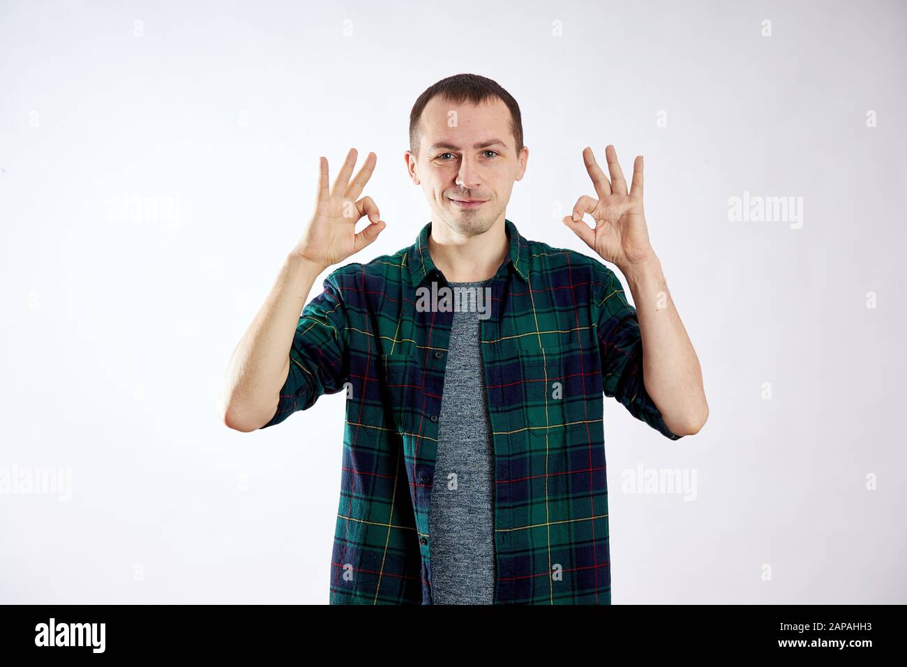 Man is happy, makes gestures with his hands, OK Stock Photo