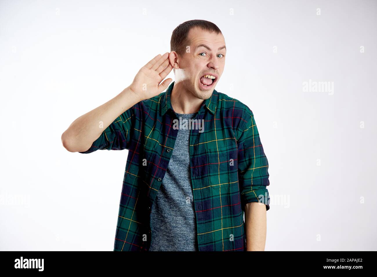 Man does not hear well, makes gestures with his hands Stock Photo