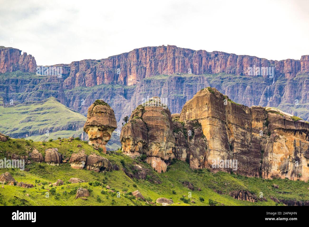 View to the rock formation Policeman's Helmet and the steep cliff faces of the Amphitheatre, Drakensberg mountains, Royal Natal National Park, South A Stock Photo
