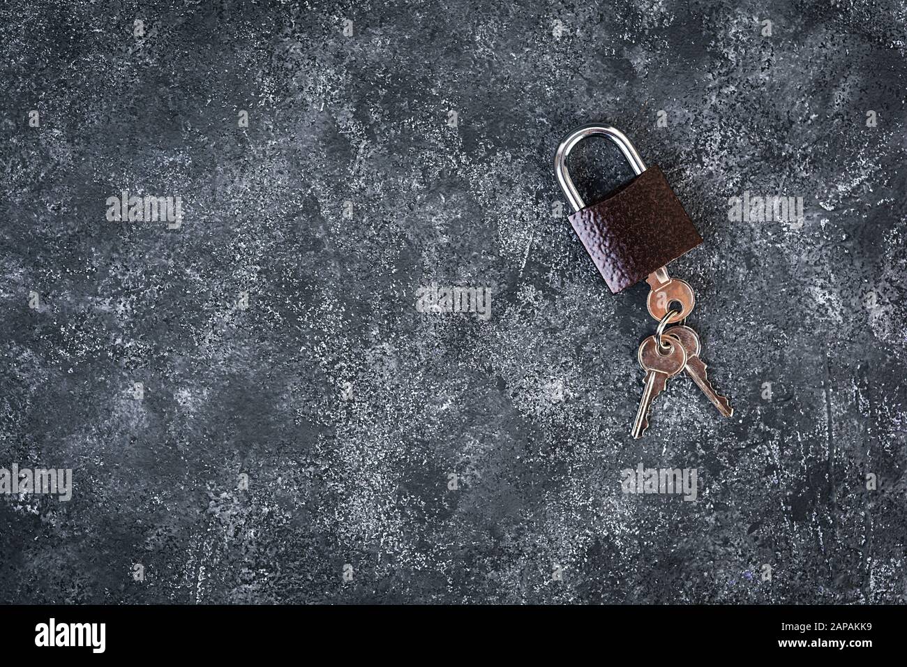 Iron lock with keys on grey background. Top view. Stock Photo