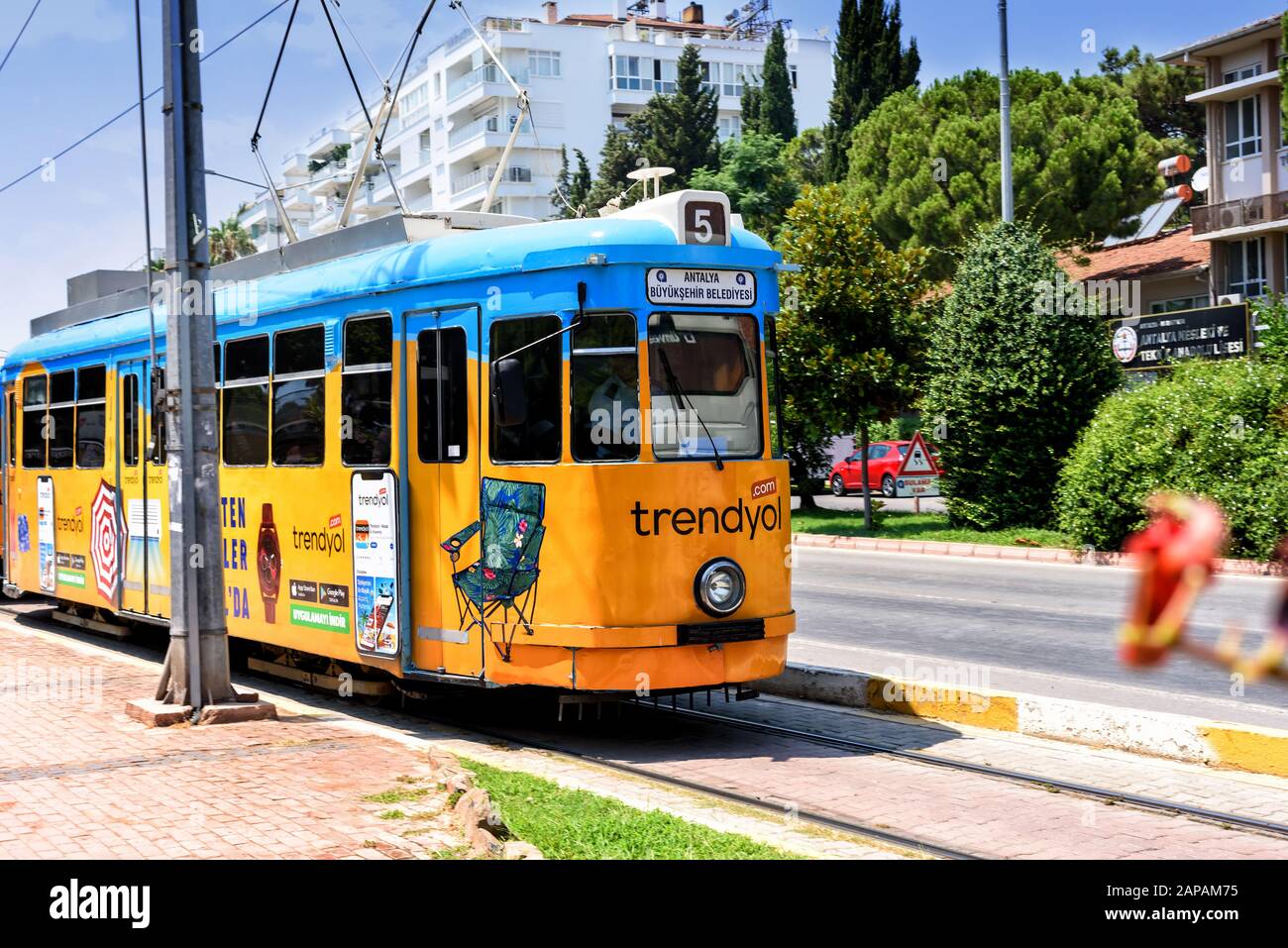 Antalya, Turkey - July 26, 2019: Old nostalgic public transport tram in ANTALYA with advertising in summer Stock Photo