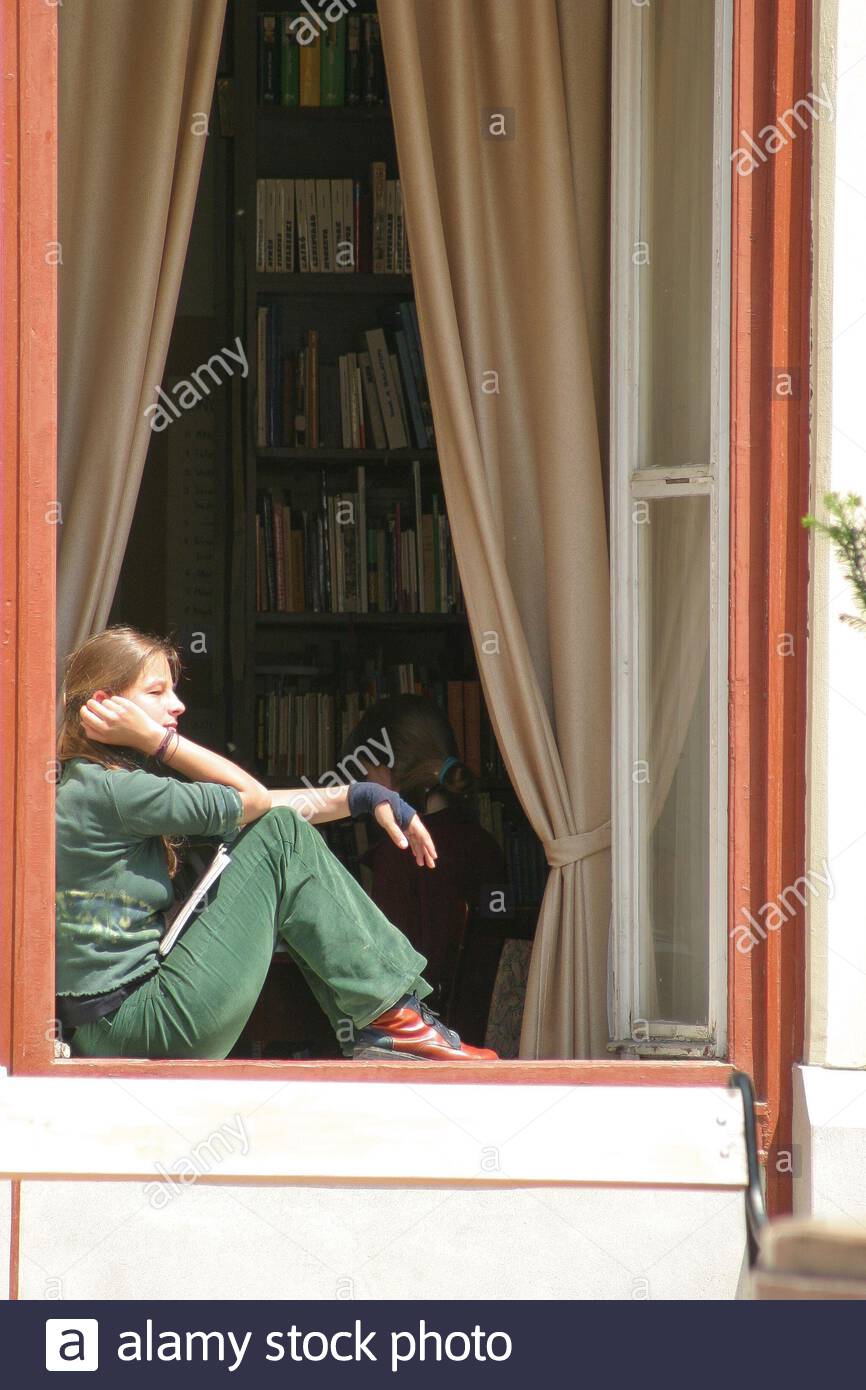 pics Bookcase Covering Window https www alamy com bookshelves or racks of book seen through an open window with net curtains as a female student sits propped against the window frame enjoying sunshine image340754835 html