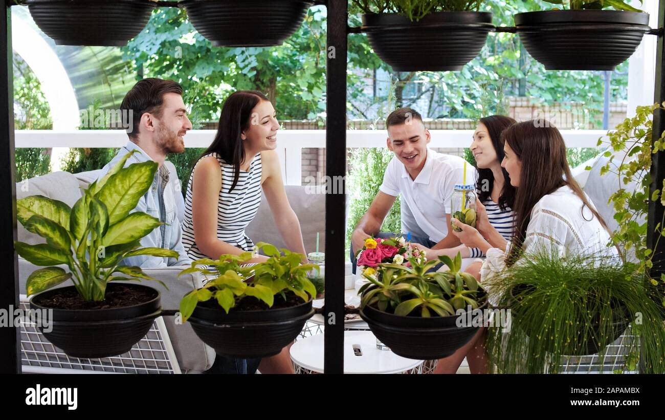 Group of friends are chatting together at cafe. Laughing enjoying together at cafe. Stock Photo