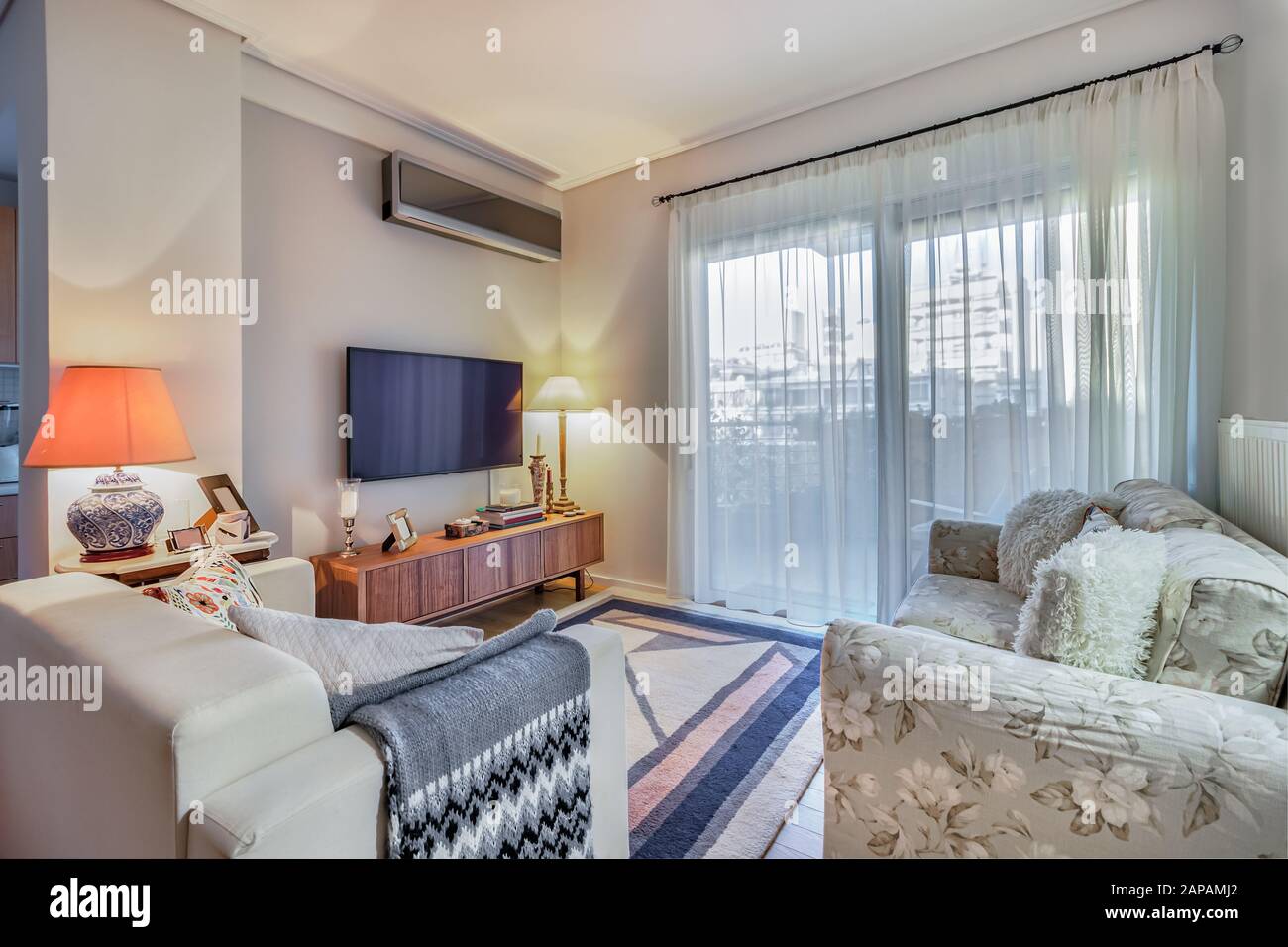 Small modern apartment living room Stock Photo - Alamy