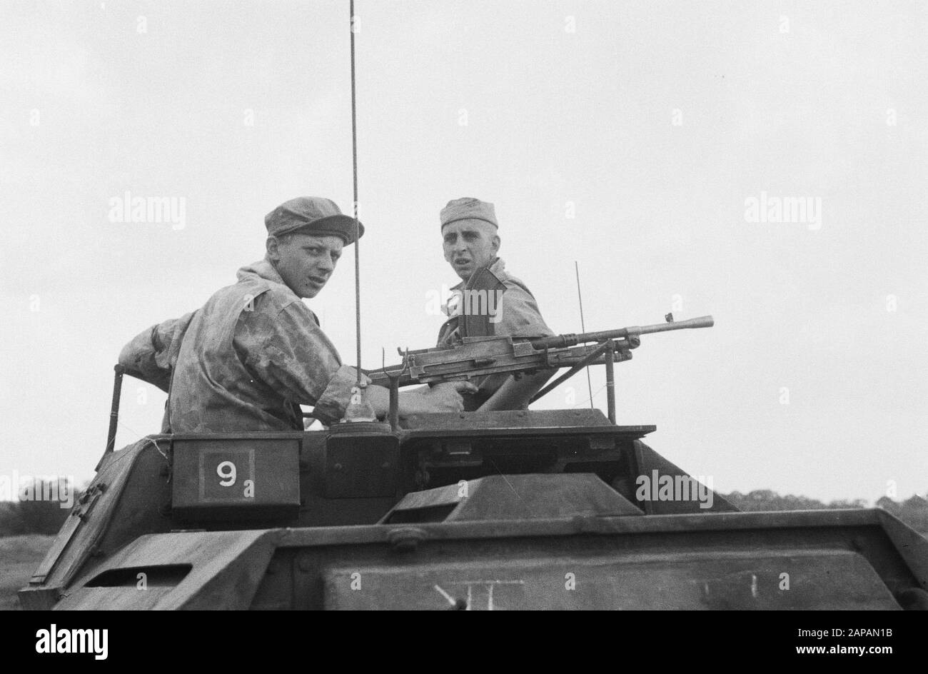 Loeboek Pakem and Baoengan Description: The first armored cars snatch into Pematang Siantar. Brenschutter and commander of Scoutcar Date: 29 July 1948 Location: Indonesia, Dutch East Indies, Sumatra Stock Photo