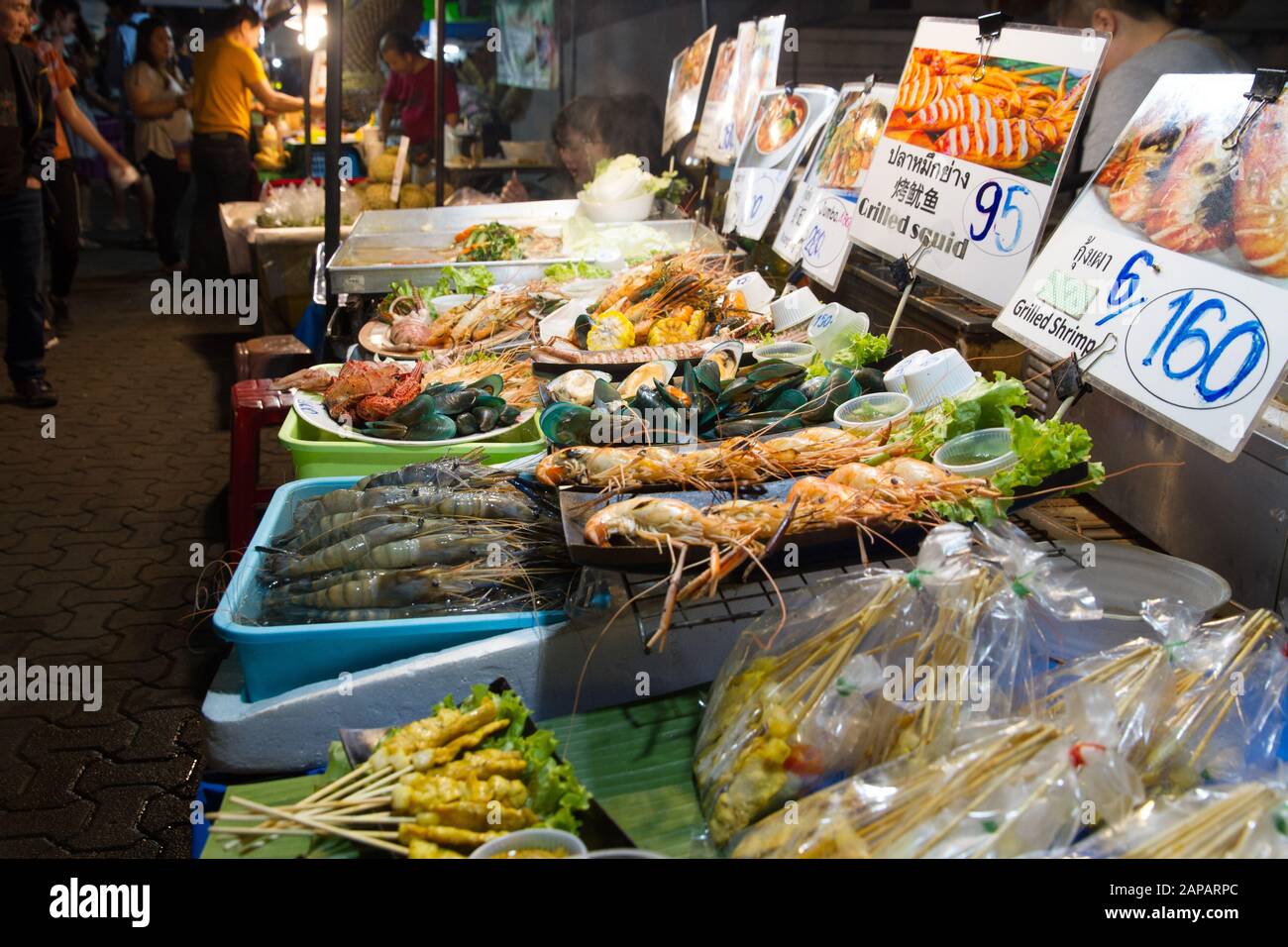 Street food, fish stall in street Sunday night Market  Chiang Mai Thailand Stock Photo