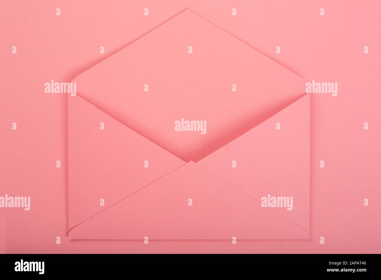 Blank open pink love letter with copy space for text on pink background ...