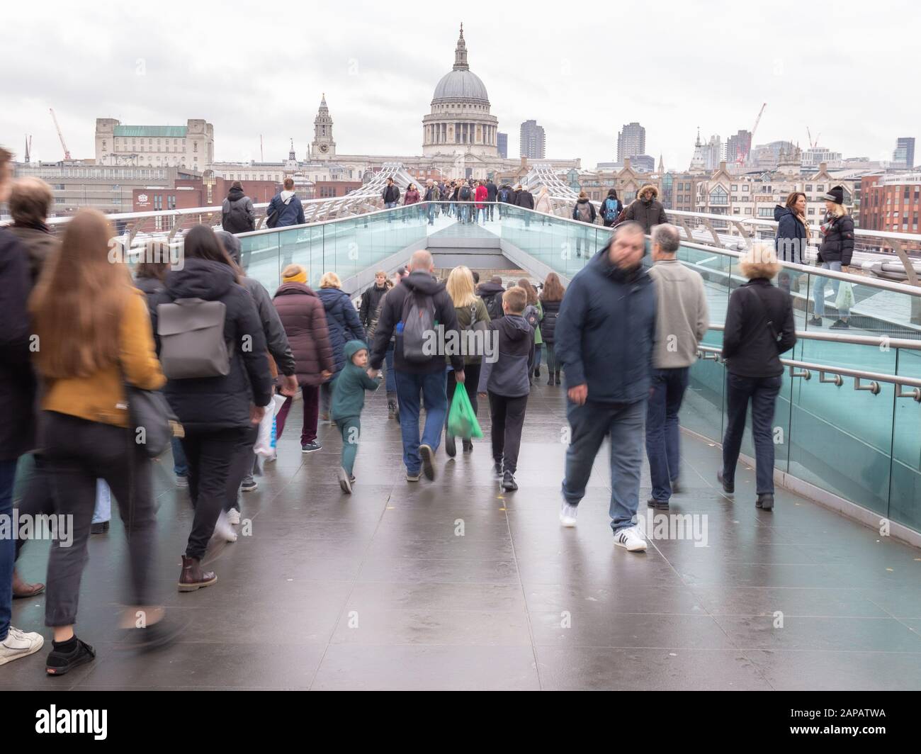 London, England - november of 2019. Crowdy Millennium Bridge in autumn day. Breidge over Thames river connecting St. Paul's Cathedral and Tate Modern Stock Photo