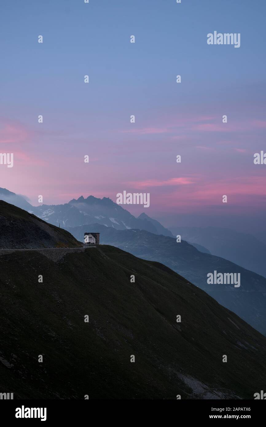 The Hotel Furka Blick on the Furka Pass mountain road at dusk in the Swiss Alps mountain top landscape of Realp, Uri, Switzerland EU Stock Photo