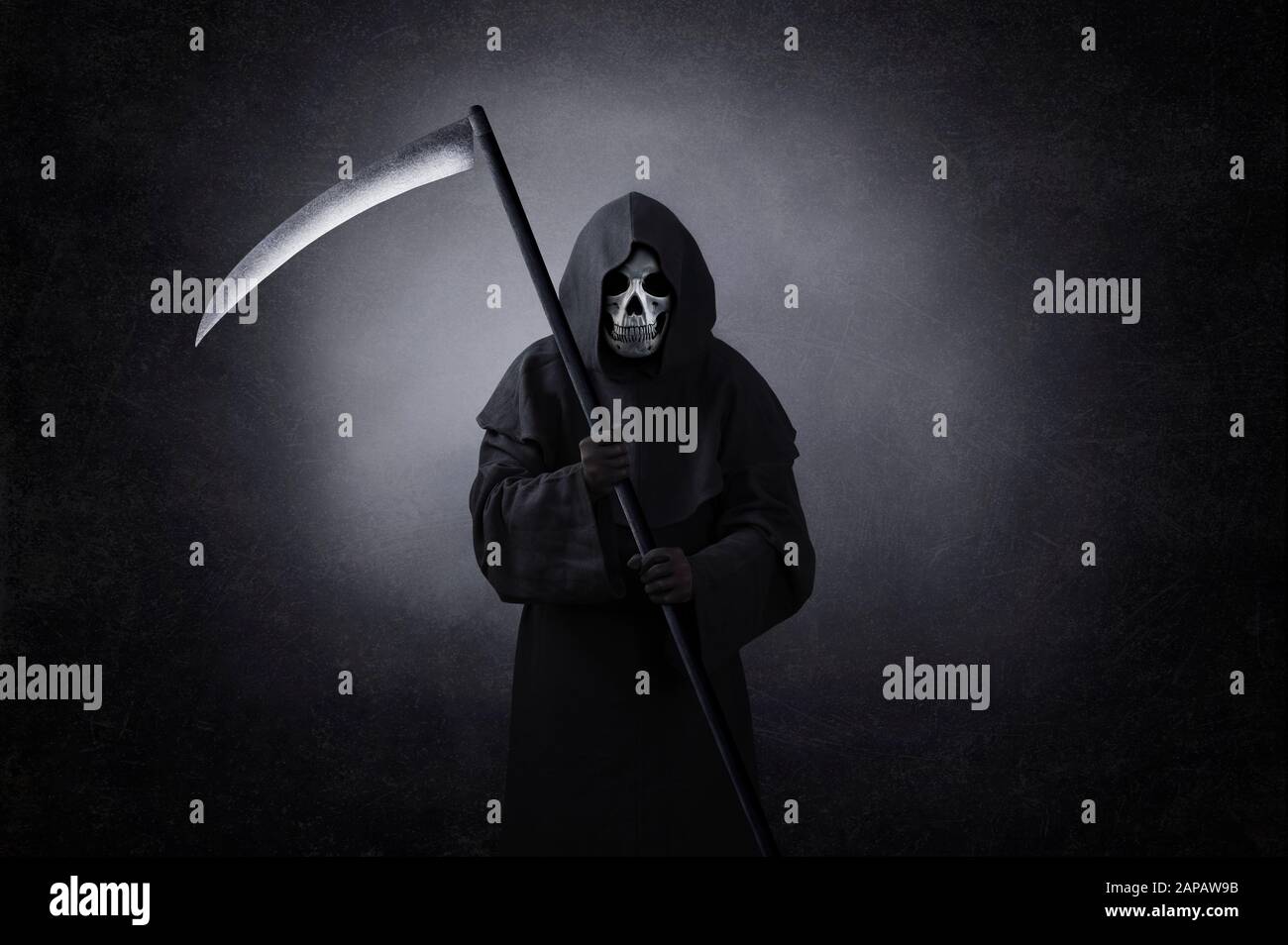 Grim reaper with scythe in the dark Stock Photo - Alamy