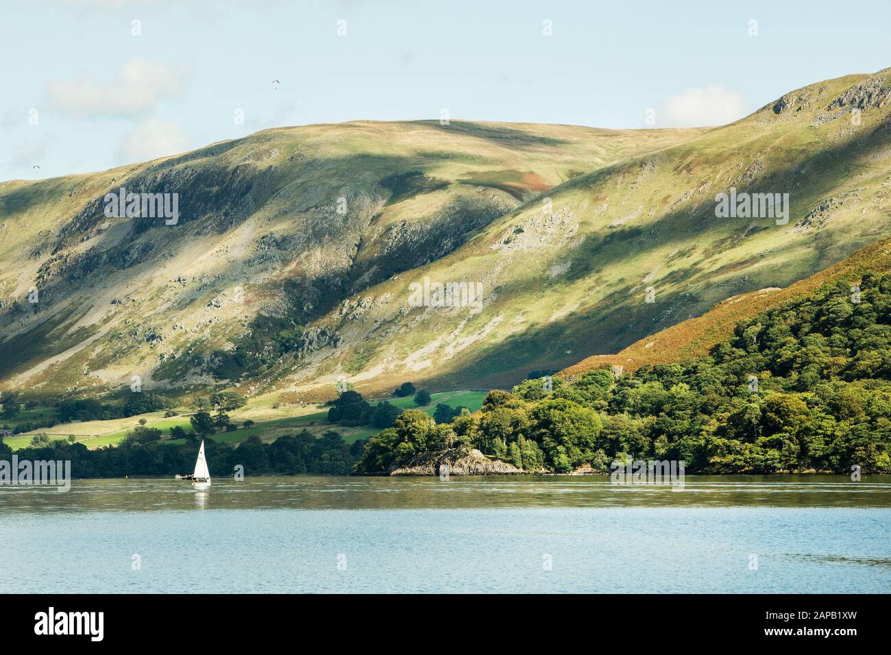 Small white yacht on a summer day, Ullswater, Lake District Stock Photo