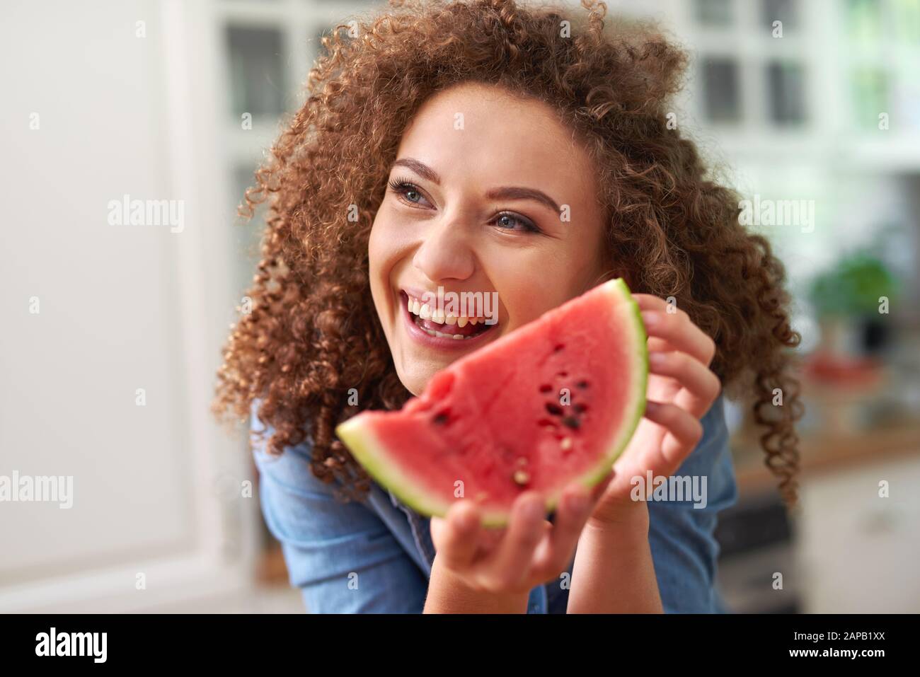 Woman with a slice of watermelon Stock Photo