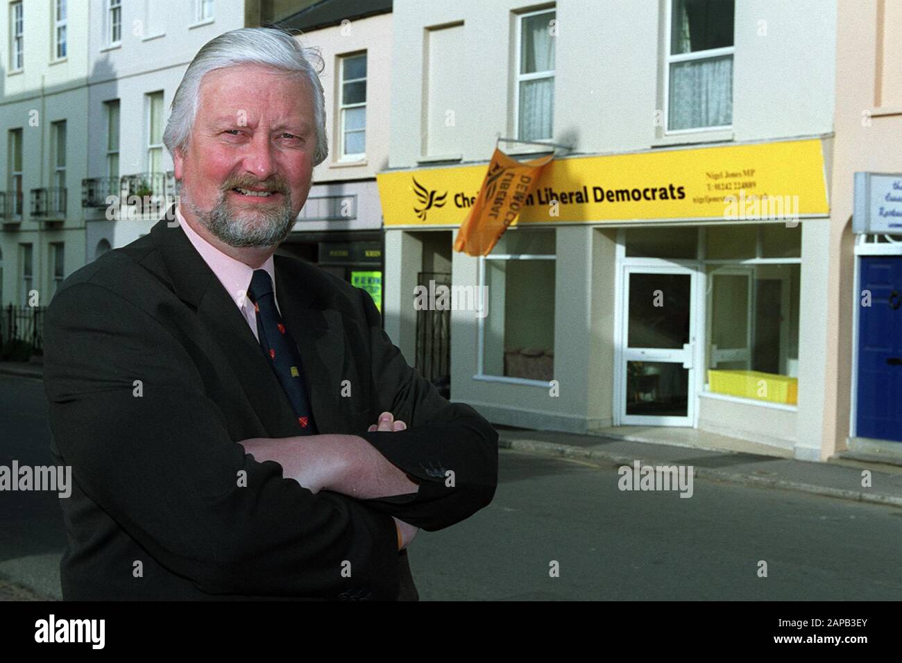 Archive of Nigel Jones MP, Now Lord Jones of Cheltenham, with his wife Katherine, outside the new Cheltenham Liberal Democrats office in Cheltenham on 10th April 2000, only months after he was attacked by Robert Ashman with a samuri sword -   On 28 January 2000, Robert Ashman entered Jones's constituency office and attacked him and his assistant, local councillor Andrew Pennington, with a katana. As a result of the attack, Pennington was killed and Jones was severely injured.[3] Jones required 57 stitches to close wounds to his hand from the assault.[4]  Jones had written a character reference Stock Photo