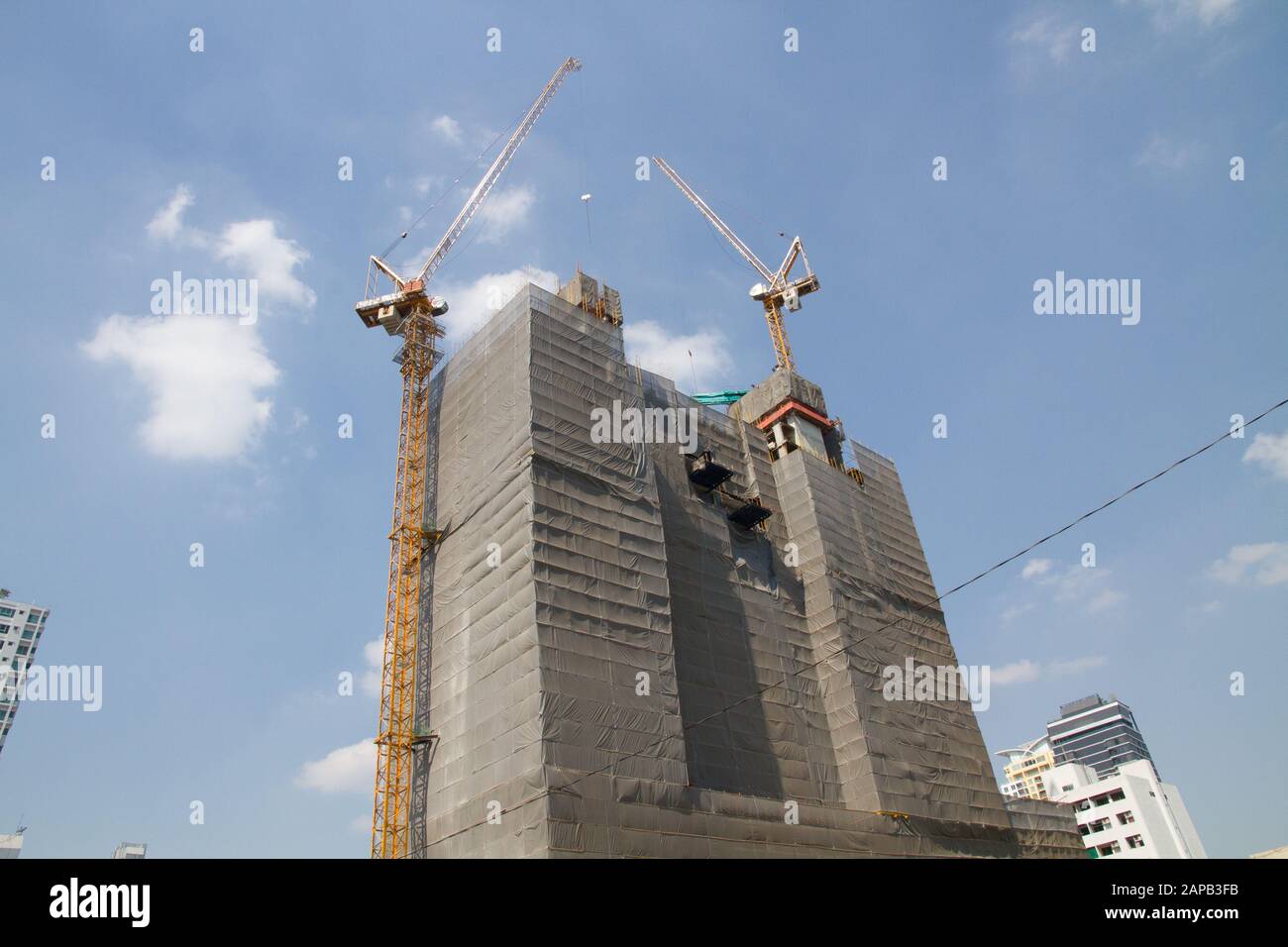 Thailand Bangkok edifice renovation big cranes on top Stock Photo