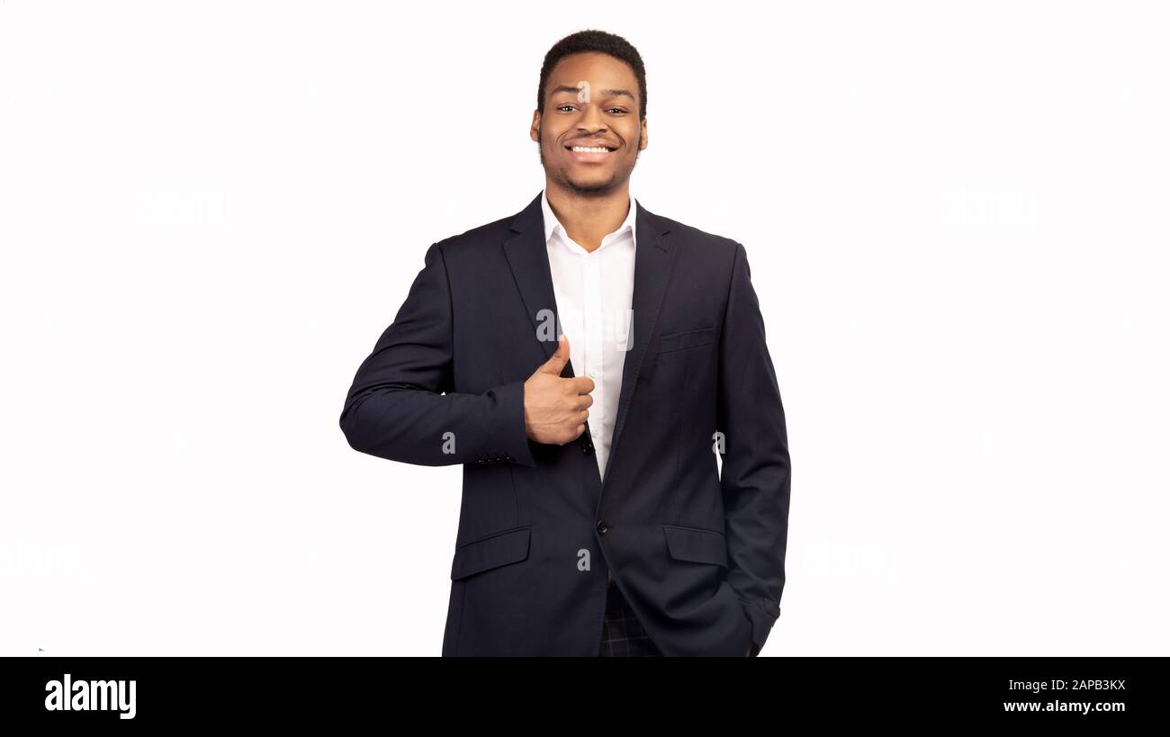 Afro guy showing thumb up and smiling Stock Photo