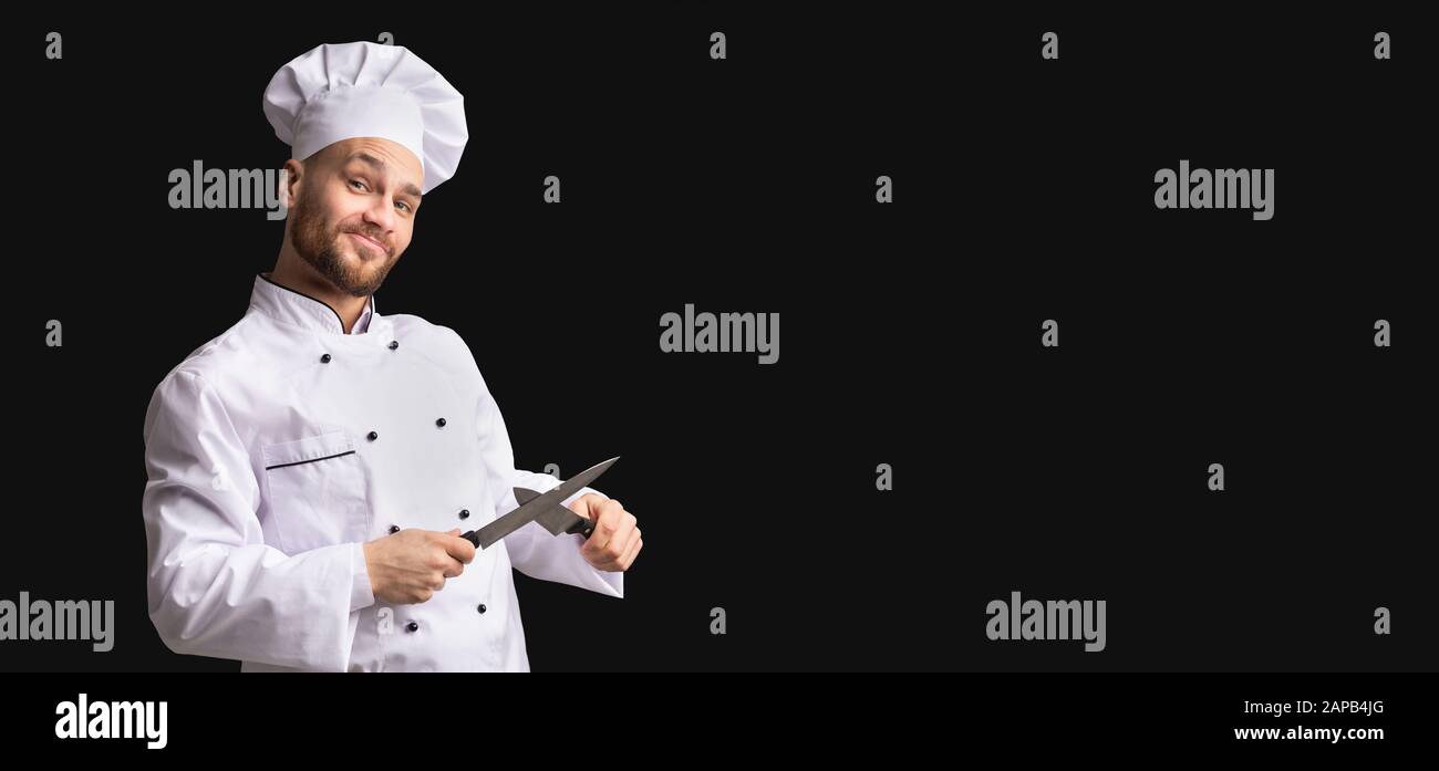 Funny Cook Guy Sharpening Knives Posing In Studio, Panorama, Stock Photo