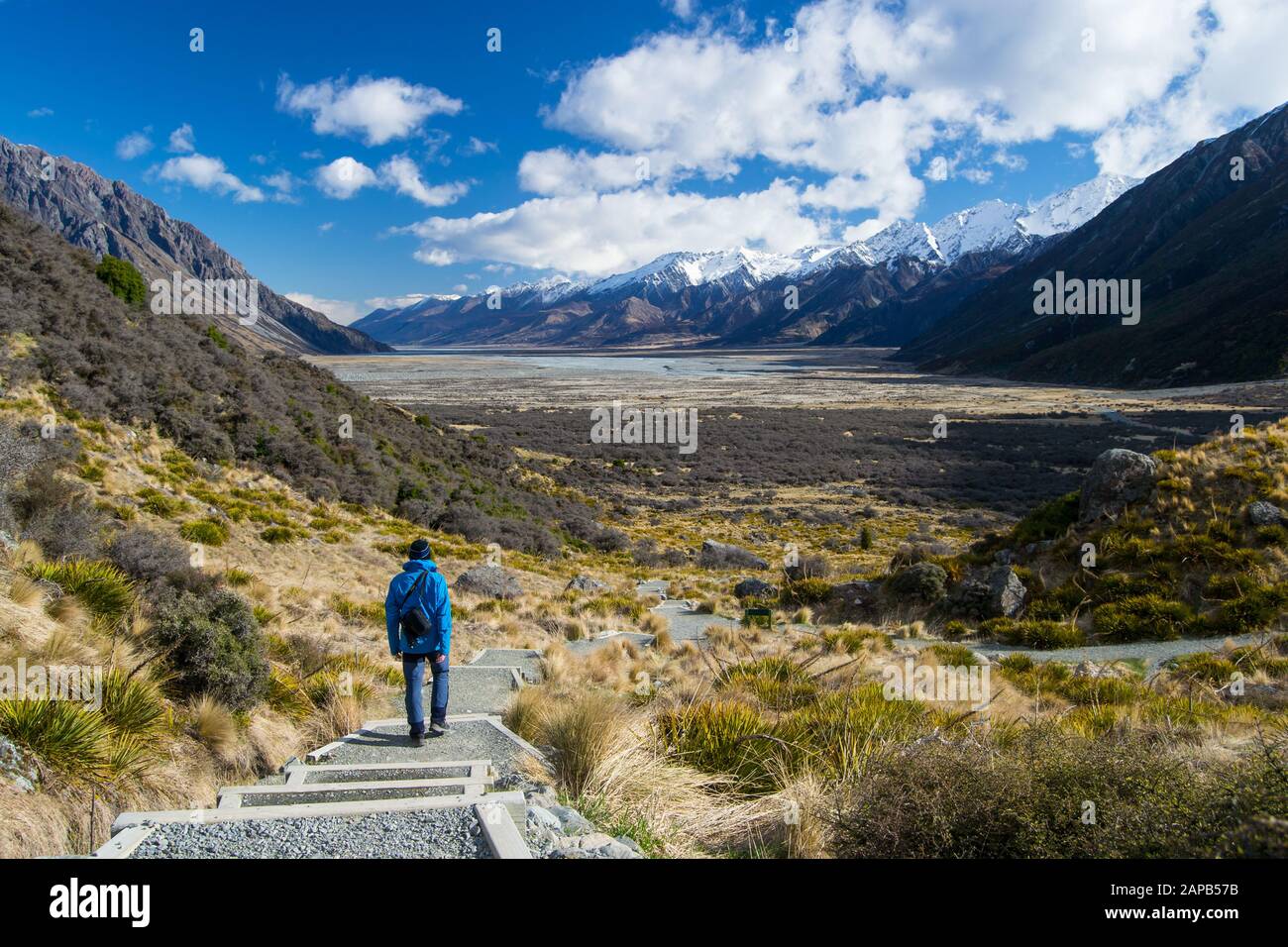 Wiew from Tasman Glacier walk with blue person in Mount Cook National Park, Aoraki, South Island, New Zealand Stock Photo