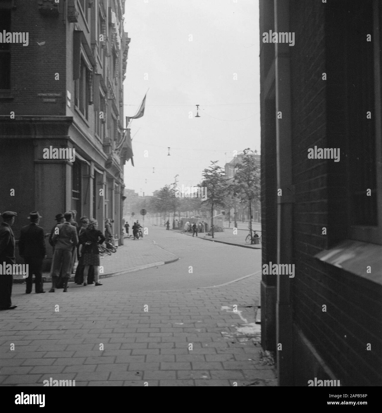 Liberation Joy: Amsterdam Description: Citizens looking for cover on the Rokin. Annotation: The liberation of Amsterdam resulted in a violent shooting incident between a unit of the BS (Domestic Armed Forces) and German soldiers, who were located in the building of the Grand Club on Dam Square. Date: 7 May 1945 Location: Amsterdam, Noord-Holland Keywords: liberation, World War II Stock Photo