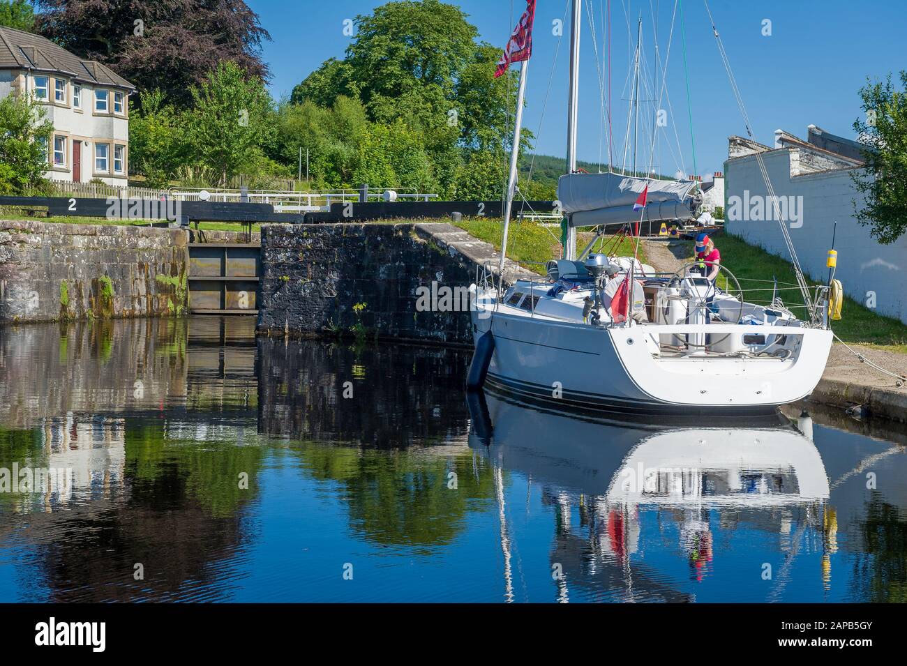 Sailing yacht waiting for gate opening and entrance to Crinan chanel. Ardrishaig, Scotland. Stock Photo