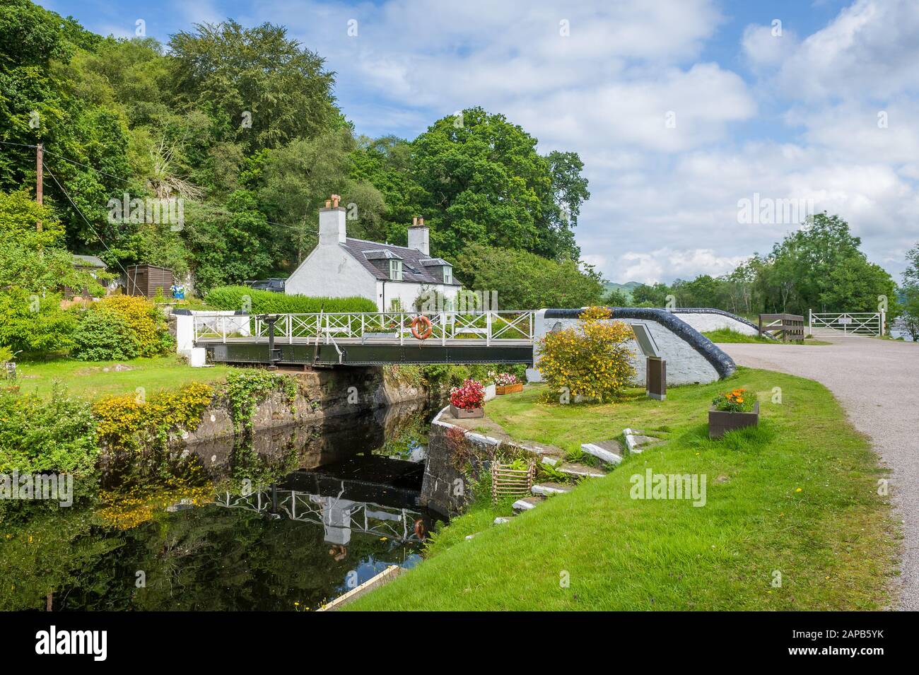 Beauty of Crinan canal - scenic water way with gates and bridges. Summer in Scotland. Stock Photo
