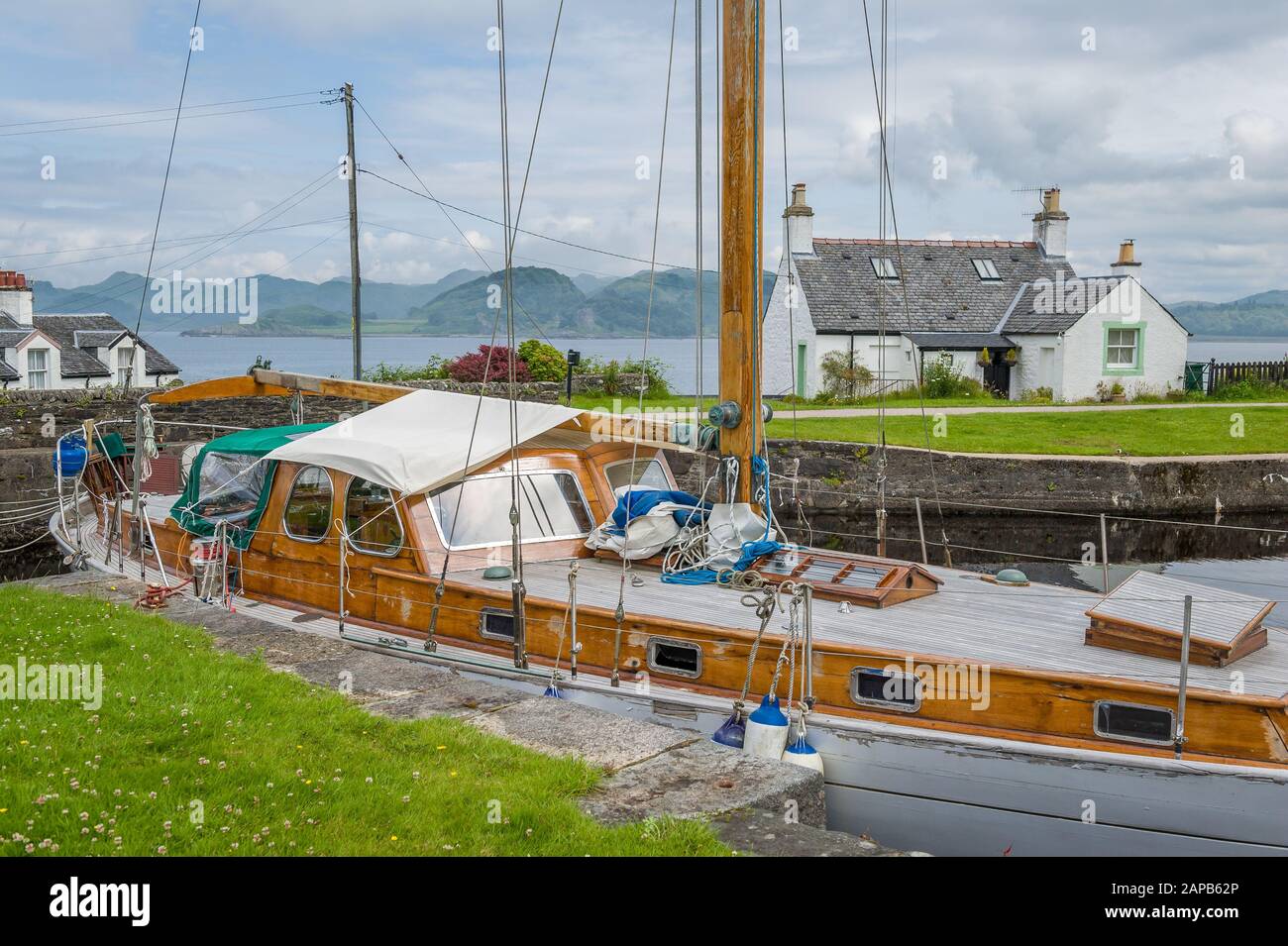 Retro wooden sailng boat docked at Crinan canal, Scotland. Stock Photo