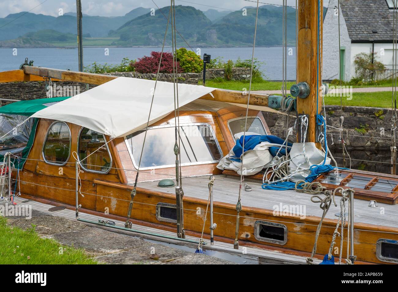 Old wooden boat, classical retro style. Crinan canal, Scotland. Stock Photo