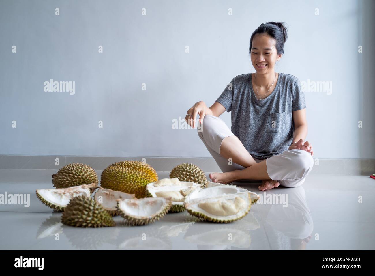 woman enjoy eating durian fruit Stock Photo Alamy