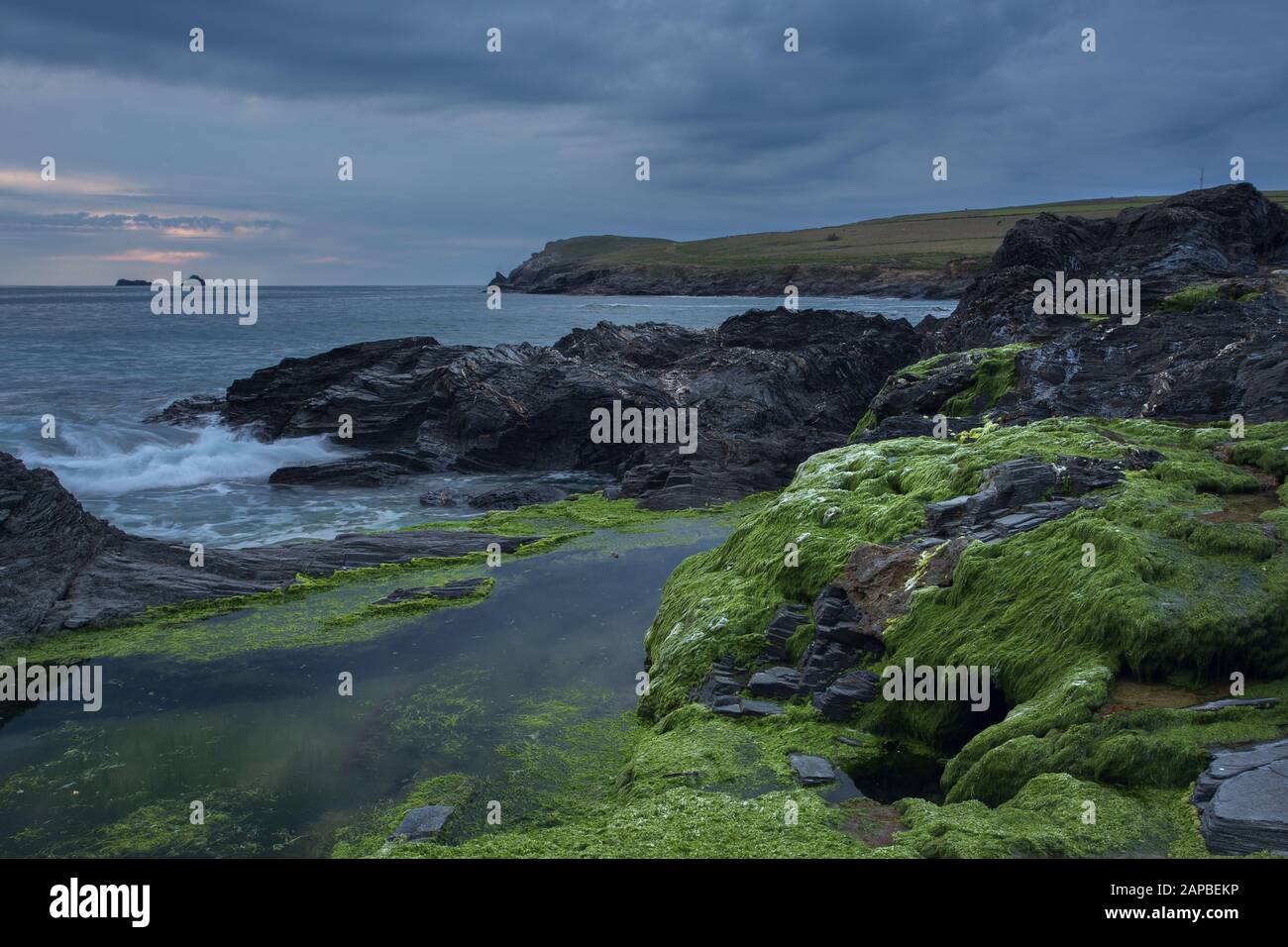 Moody skies and rocky shores at Booby's Bay Cornwall Stock Photo