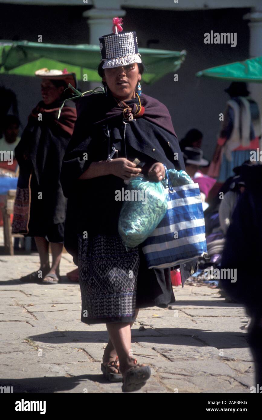 BOLIVIA  Woman of Sucre carrying bag of coca leaves  photo by Sean Sprague Stock Photo