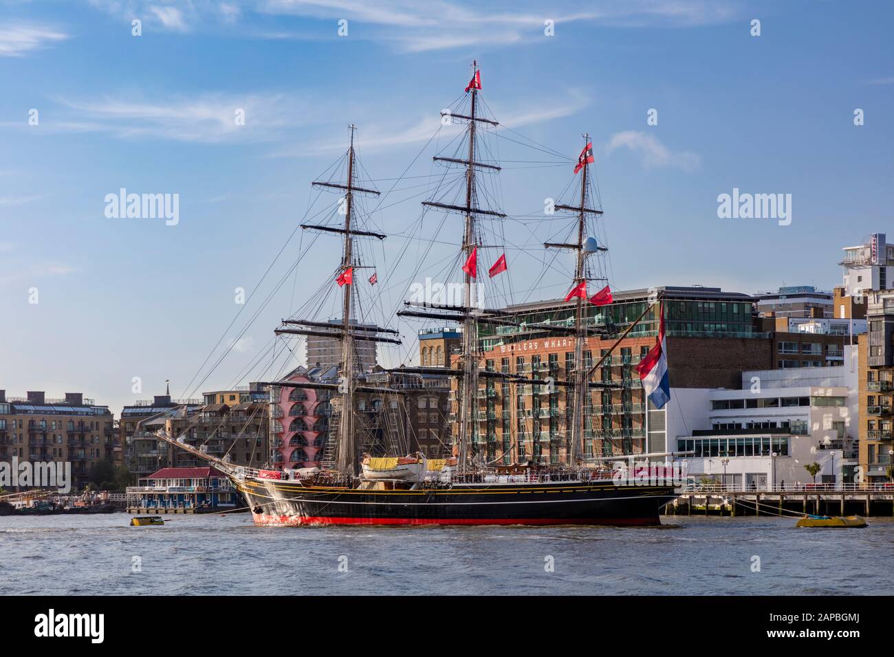 Clipper Ship Stad Amsterdam and Butlers Wharf along the South Bank of River Thames, London, England, UK Stock Photo
