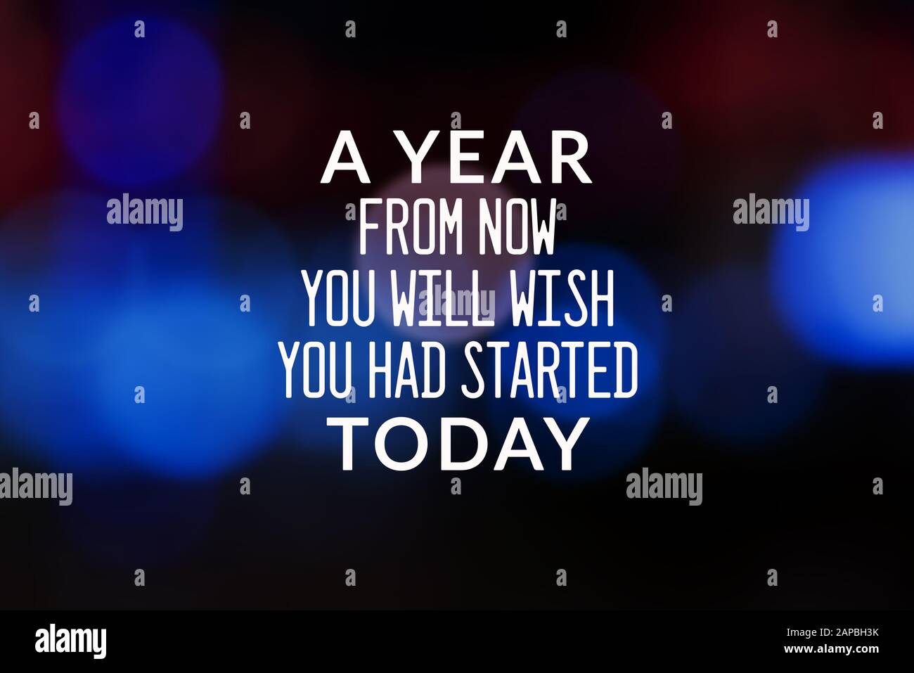 Motivational and Life Inspirational Quotes - A year from now you will wish you had started today. Blurry background. Stock Photo